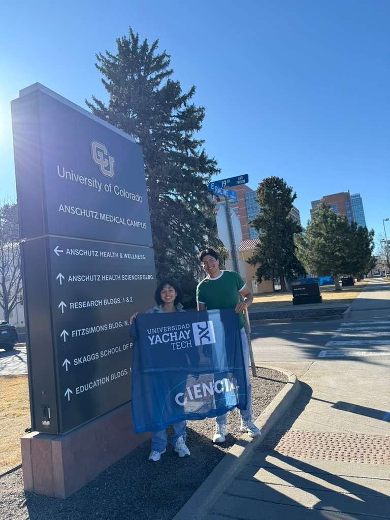 Participants with Yachay Tech flag at CU Anschutz Medical Campus