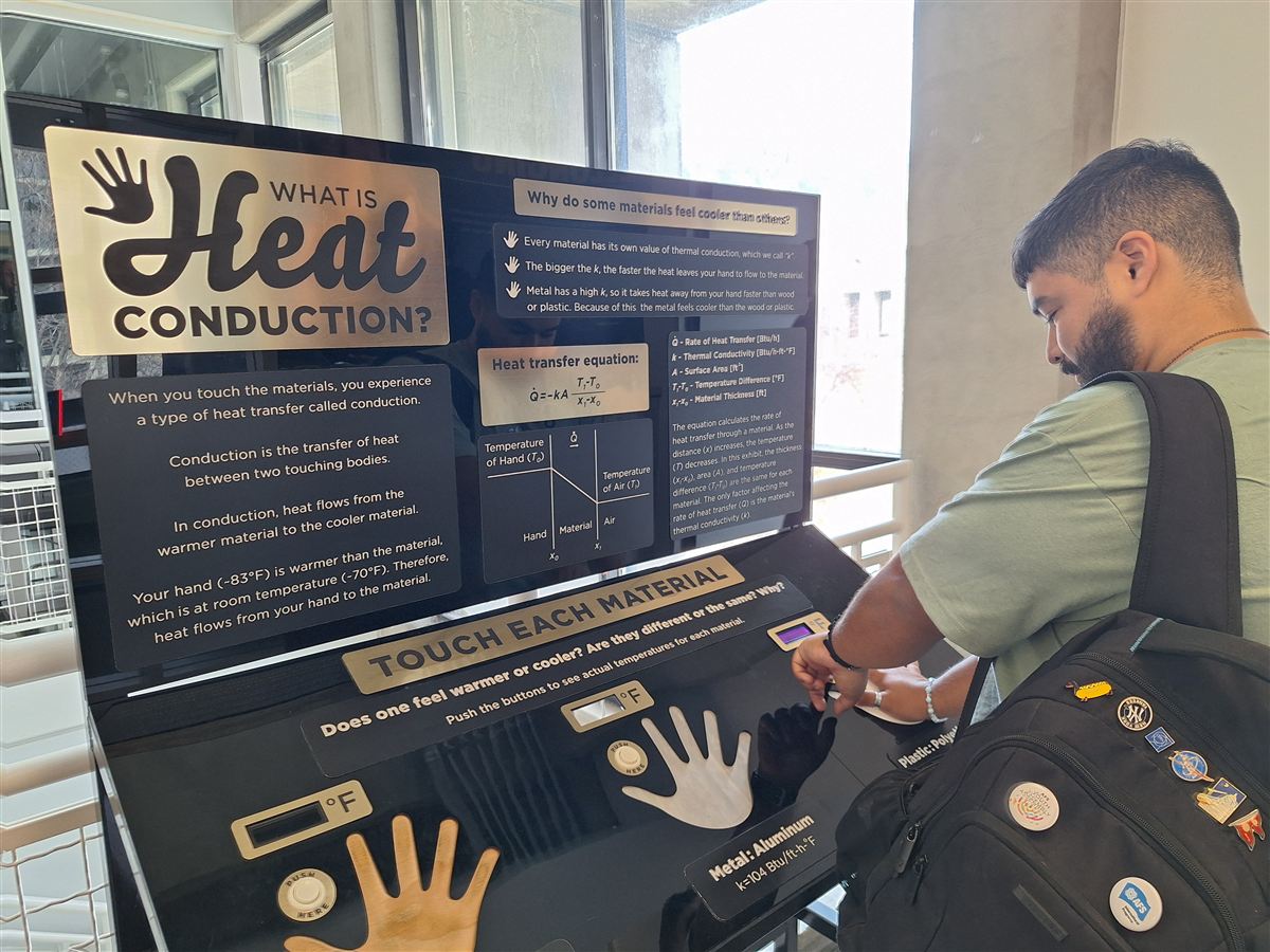 Participant at interactive science exhibit, Boulder
