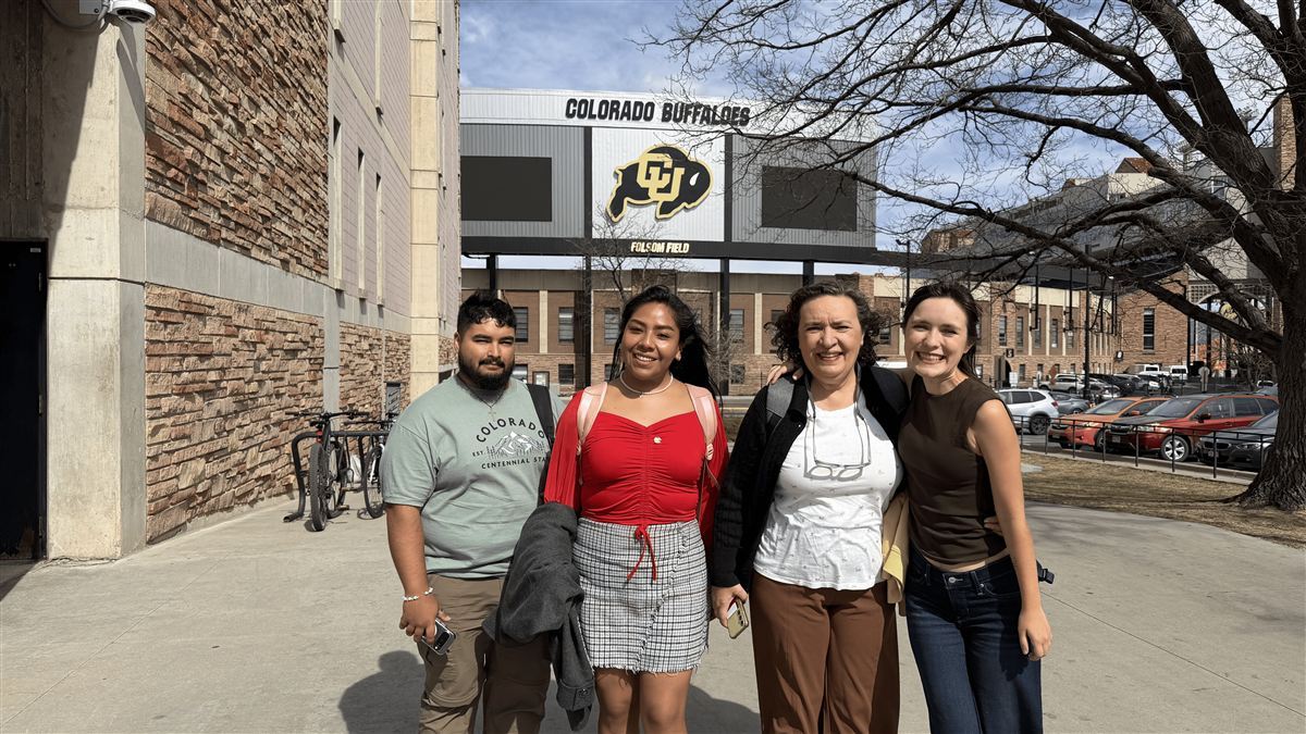 Exchange participants with CU Buffalo statue
