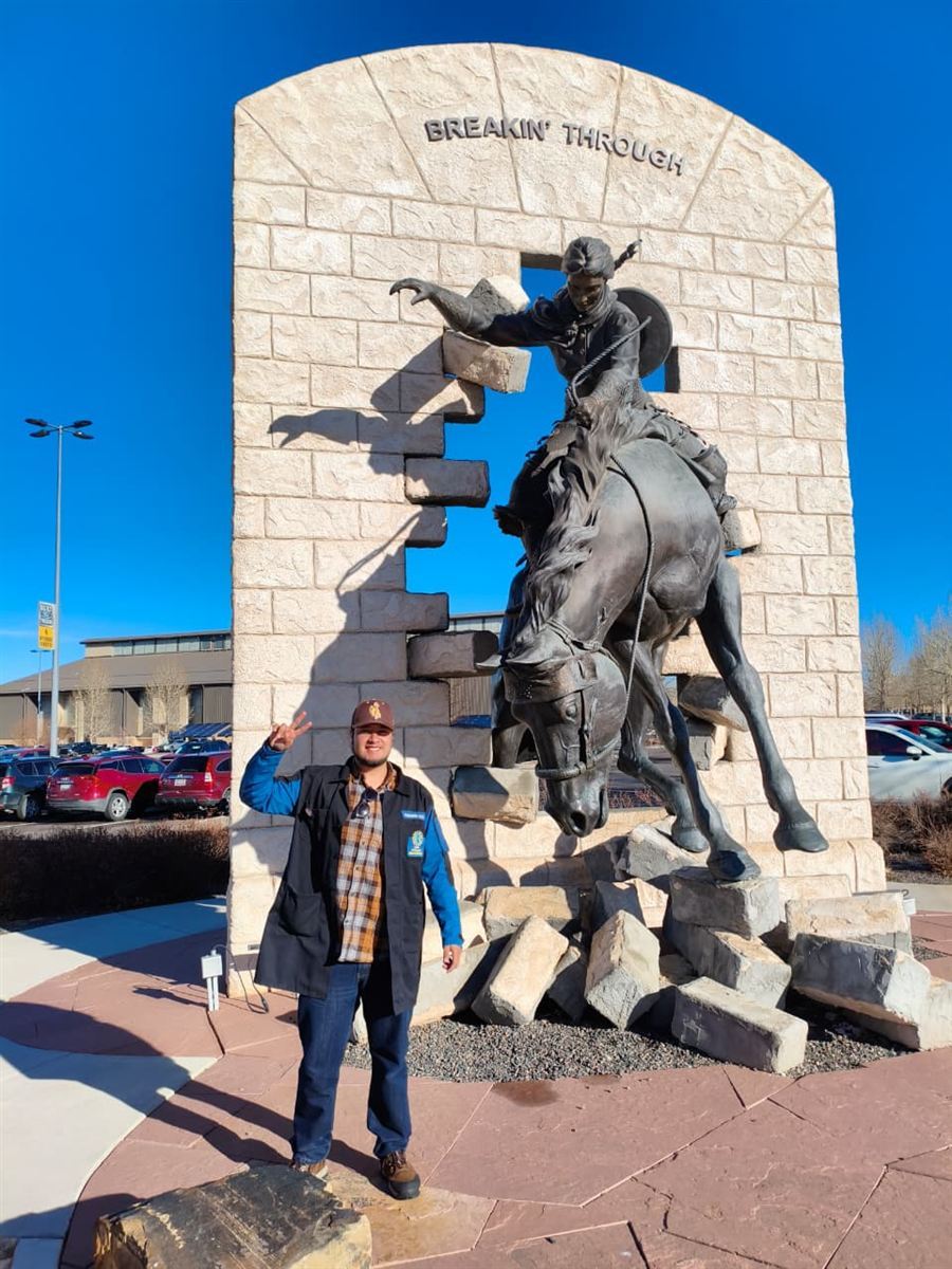 Participant at 'Breakin' Through' statue, University of Wyoming