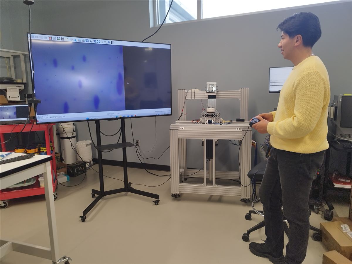 Participant operating scientific equipment in lab